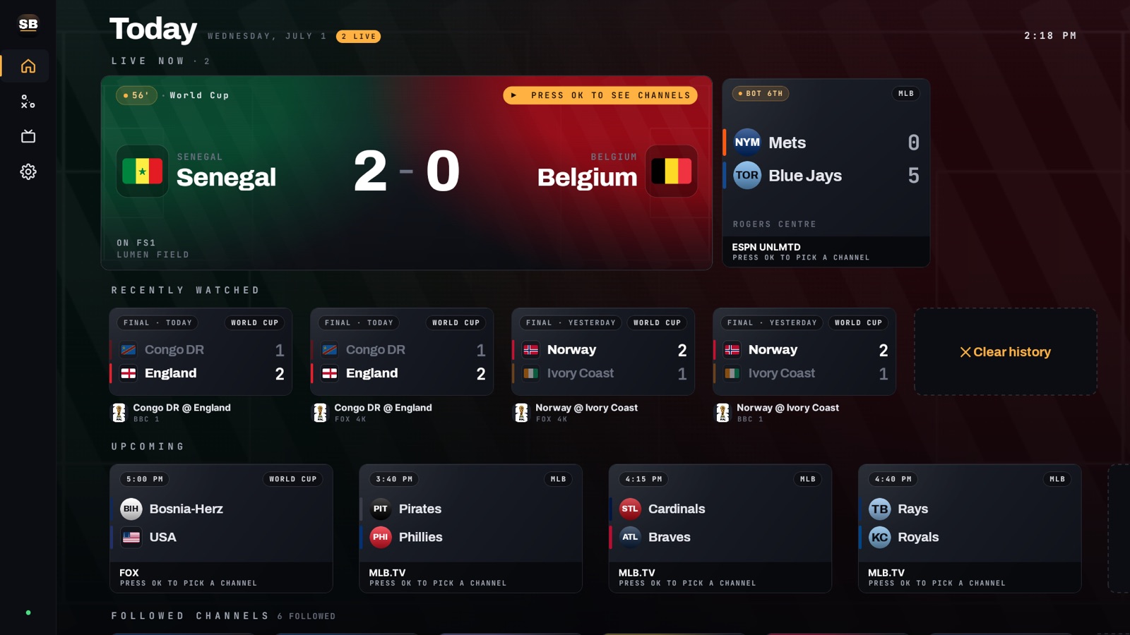 ScoreBox home screen with a live World Cup game, scores, and the background lit in the teams' colors